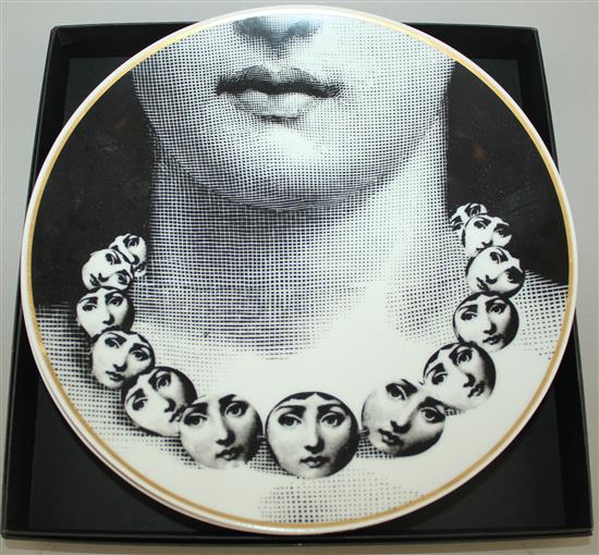 A collection of Fornasetti Temi e Variazioni and musical trophy pattern items,